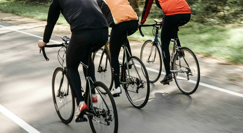 a group of people riding bikes